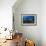 A Diver Looks on at a Lionfish Hovering Above Staghorn Coral, Indonesia-null-Framed Photographic Print displayed on a wall