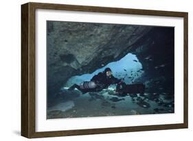 A Diver Using a Diver Propulsion Vehicle in the Blue Springs Cave System-null-Framed Art Print