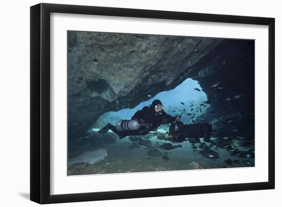 A Diver Using a Diver Propulsion Vehicle in the Blue Springs Cave System-null-Framed Art Print