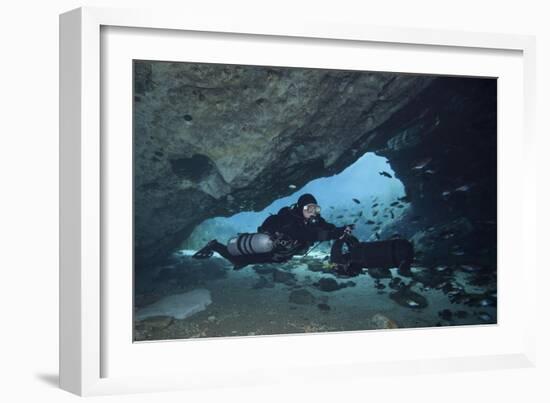 A Diver Using a Diver Propulsion Vehicle in the Blue Springs Cave System-null-Framed Art Print