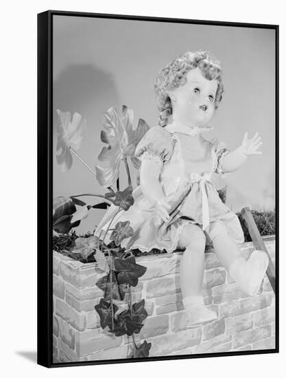 A Doll Sitting on a Wall-null-Framed Stretched Canvas