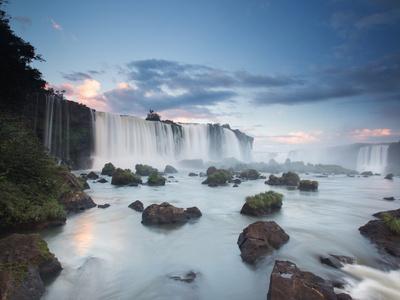 https://imgc.allpostersimages.com/img/posters/a-dramatic-sunset-over-iguacu-waterfalls_u-L-PNCJ3N0.jpg?artPerspective=n