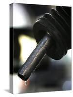 A Drip of Gas Falls from Nozzle at a Gasoline Station-null-Stretched Canvas