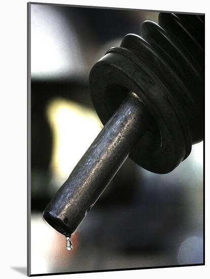 A Drip of Gas Falls from Nozzle at a Gasoline Station-null-Mounted Photographic Print