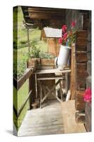 A Empty Milk Can Upside Down on Wooden Table Outside an Alpine Chalet-Eising Studio - Food Photo and Video-Stretched Canvas