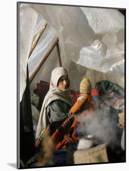 A Family from the Quake-Affected Rangwad Village Sits Near a Fireplace-null-Mounted Photographic Print