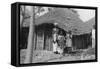 A Family in Front of their Home, Gambia, 20th Century-null-Framed Stretched Canvas