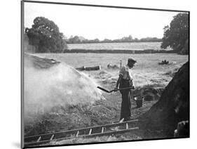 A Farmer Holding a Shovel on a Farm in England, 1938-null-Mounted Photographic Print