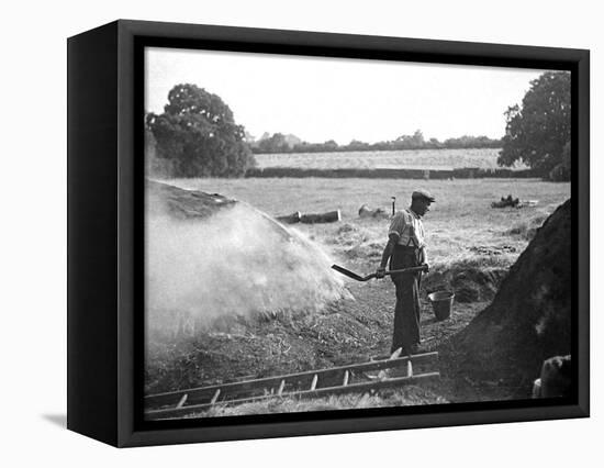 A Farmer Holding a Shovel on a Farm in England, 1938-null-Framed Stretched Canvas