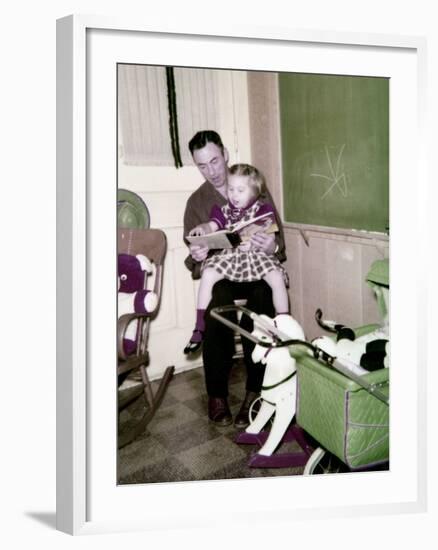 A Father Reads to His 4 Year Old Daughter, Ca. 1957-null-Framed Photographic Print