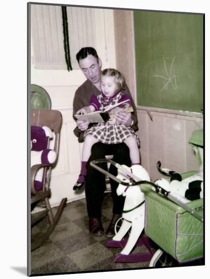 A Father Reads to His 4 Year Old Daughter, Ca. 1957-null-Mounted Photographic Print