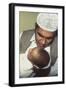 A Father Whispers the Opening Words of the Muslim Shahada in His Newborn Baby's Ear-null-Framed Photographic Print