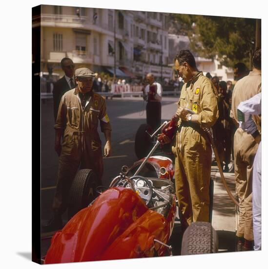 A Ferrari Team Member Filling a Car with Fuel, Monaco Grand Prix, Monte Carlo, 1963-null-Stretched Canvas