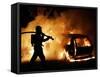 A Firefighter Extinguishes a Car in Les Musicians-null-Framed Stretched Canvas