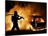 A Firefighter Extinguishes a Car in Les Musicians-null-Stretched Canvas