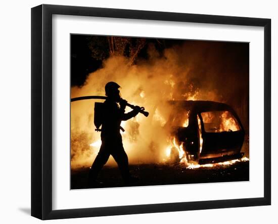 A Firefighter Extinguishes a Car in Les Musicians-null-Framed Premium Photographic Print