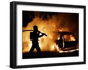 A Firefighter Extinguishes a Car in Les Musicians-null-Framed Premium Photographic Print