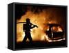 A Firefighter Extinguishes a Car in Les Musicians-null-Framed Stretched Canvas