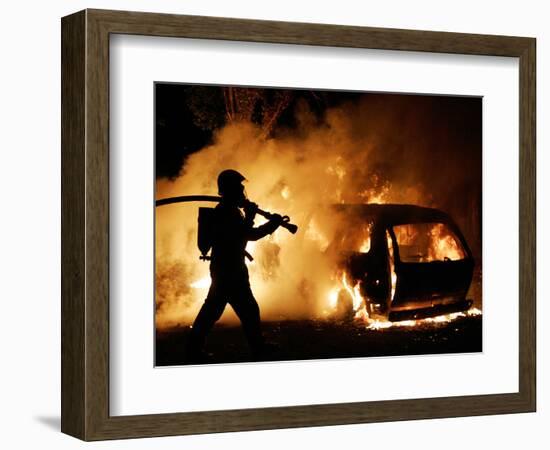 A Firefighter Extinguishes a Car in Les Musicians-null-Framed Photographic Print