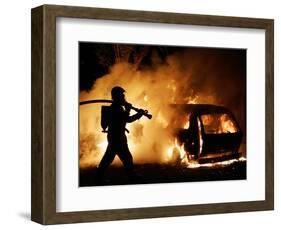 A Firefighter Extinguishes a Car in Les Musicians-null-Framed Photographic Print