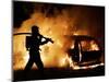 A Firefighter Extinguishes a Car in Les Musicians-null-Mounted Photographic Print