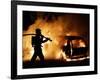 A Firefighter Extinguishes a Car in Les Musicians-null-Framed Photographic Print