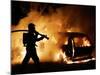 A Firefighter Extinguishes a Car in Les Musicians-null-Mounted Photographic Print