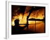 A Firefighter Tries to Extinguish a Raging Fire-null-Framed Photographic Print