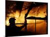 A Firefighter Tries to Extinguish a Raging Fire-null-Mounted Photographic Print