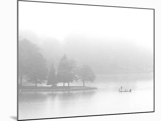 A Fisherman Fishes off the Point of a Peninsula-null-Mounted Photographic Print