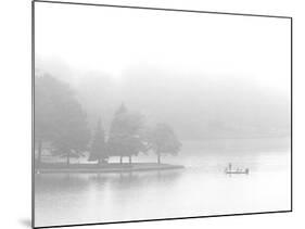 A Fisherman Fishes off the Point of a Peninsula-null-Mounted Photographic Print