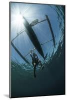 A Fisherman Uses a Wooden Outrigger Near a Remote Island in Indonesia-Stocktrek Images-Mounted Photographic Print