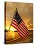 A Flag Waves Over Pearl Harbor as Dawn Breaks-null-Stretched Canvas