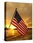A Flag Waves Over Pearl Harbor as Dawn Breaks-null-Stretched Canvas