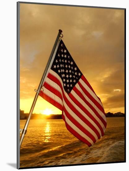 A Flag Waves Over Pearl Harbor as Dawn Breaks-null-Mounted Photographic Print