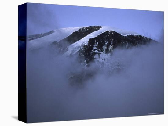 A Foggy Look at Mountain Summit, Kilimanjaro-Michael Brown-Stretched Canvas