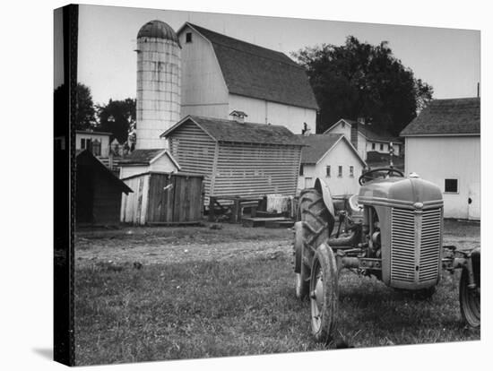 A Ford Tractor Being Sold During the Farmhouse Auction-null-Stretched Canvas