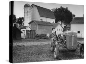 A Ford Tractor Being Sold During the Farmhouse Auction-null-Stretched Canvas