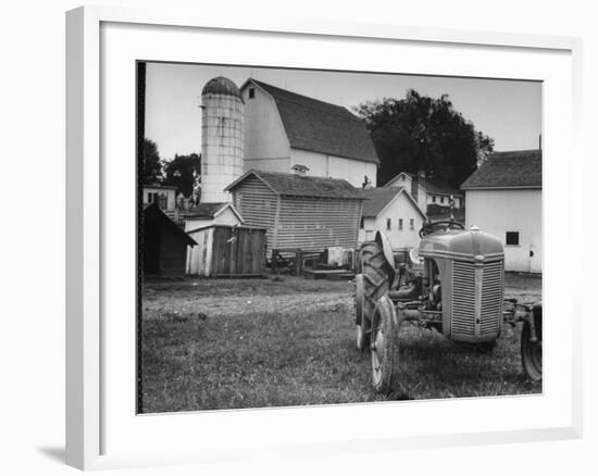 A Ford Tractor Being Sold During the Farmhouse Auction-null-Framed Photographic Print