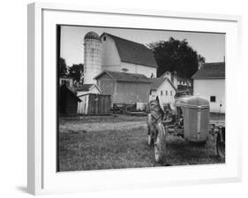 A Ford Tractor Being Sold During the Farmhouse Auction-null-Framed Photographic Print