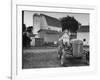 A Ford Tractor Being Sold During the Farmhouse Auction-null-Framed Photographic Print