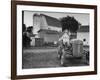 A Ford Tractor Being Sold During the Farmhouse Auction-null-Framed Photographic Print