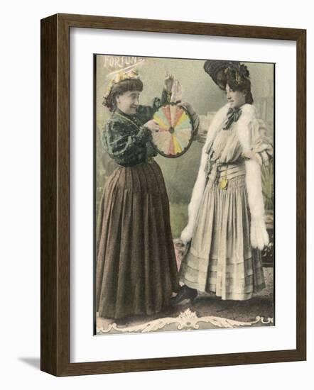 A Fortune-Teller Uses a 'Wheel of Fortune'-null-Framed Photographic Print