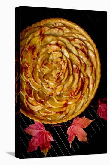 A Fresh Baked French Apple Tart with Colorful Fall Leaves Placed on a Cooling Rack-Cynthia Classen-Stretched Canvas