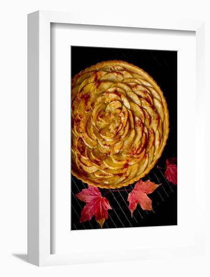 A Fresh Baked French Apple Tart with Colorful Fall Leaves Placed on a Cooling Rack-Cynthia Classen-Framed Photographic Print