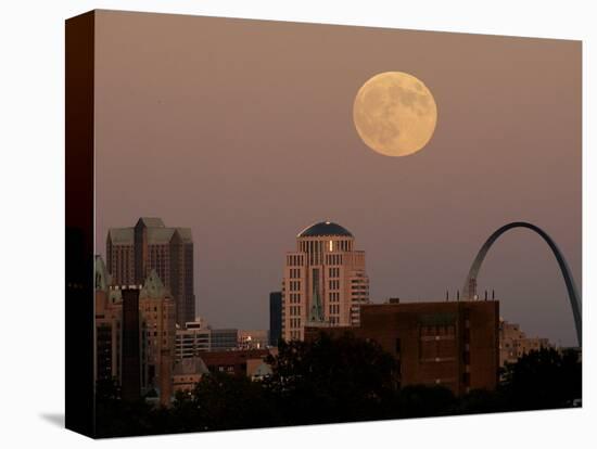 A Full Moon Rises Behind Downtown Saint Louis Buildings and the Gateway Arch Friday-Charlie Riedel-Stretched Canvas