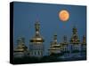 A Full Moon Rises in the Night Sky During a Lunar Eclipse-null-Stretched Canvas