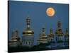 A Full Moon Rises in the Night Sky During a Lunar Eclipse-null-Stretched Canvas