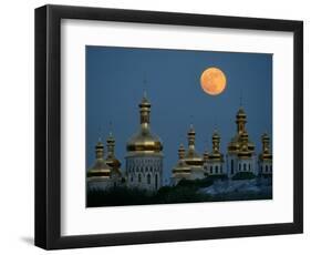 A Full Moon Rises in the Night Sky During a Lunar Eclipse-null-Framed Photographic Print