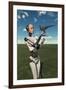 A Futuristic Android Holding a Baby Tyrannosaurus Rex in its Hands-null-Framed Art Print